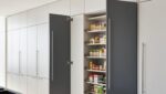 L-shaped kitchen with pure white and slate grey finish